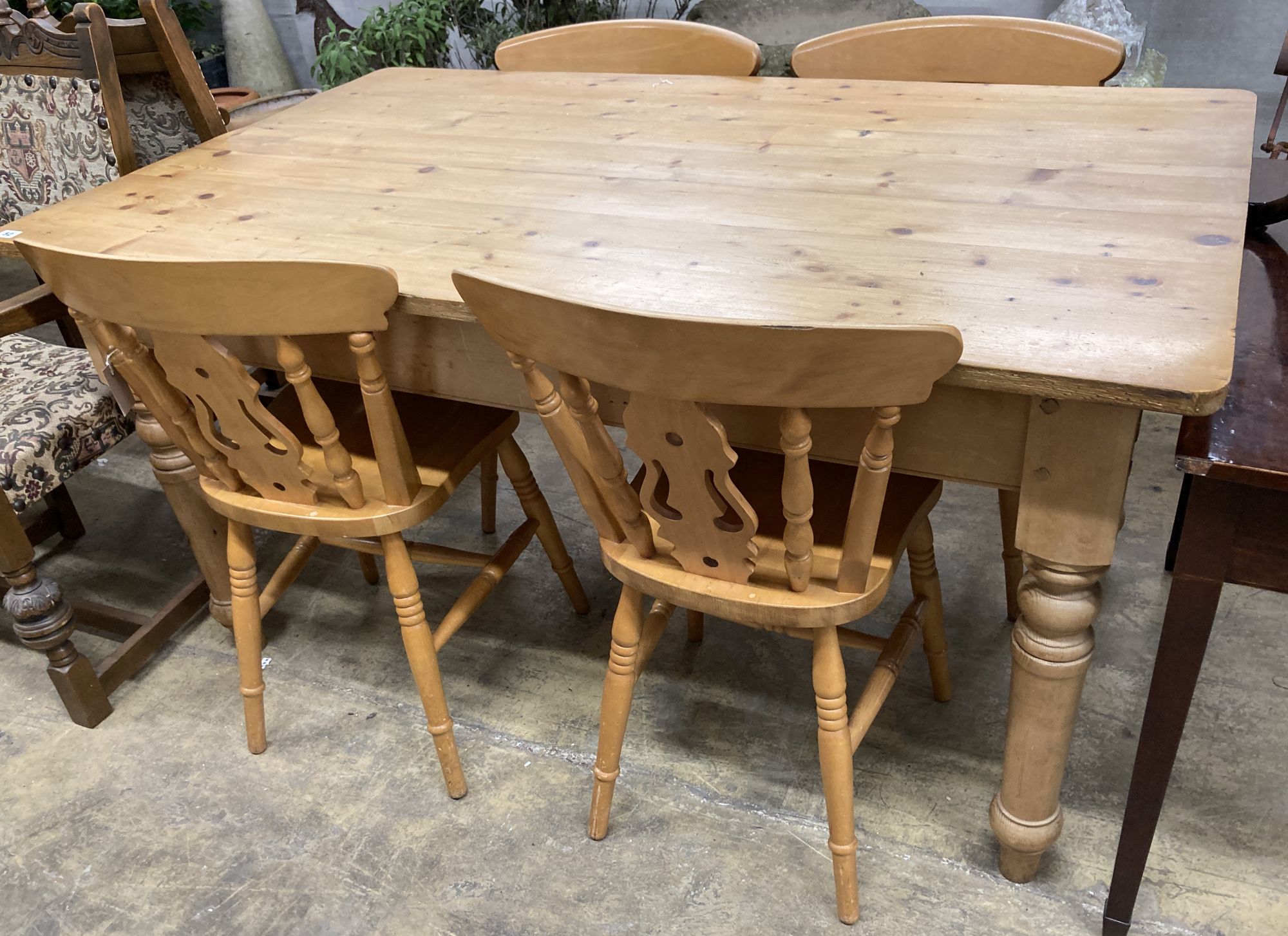 A Victorian style rectangular pine kitchen table, length 152cm, depth 90cm, height 78cm, together with four Windsor beech kitchen chairs